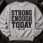Grey sweatshirt with black distressed text "STRONG ENOUGH TODAY" and barbell graphic.