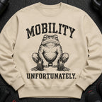 Light beige sweatshirt with distressed graphic of a toad holding a dumbbell and text "MOBILITY UNFORTUNATELY".