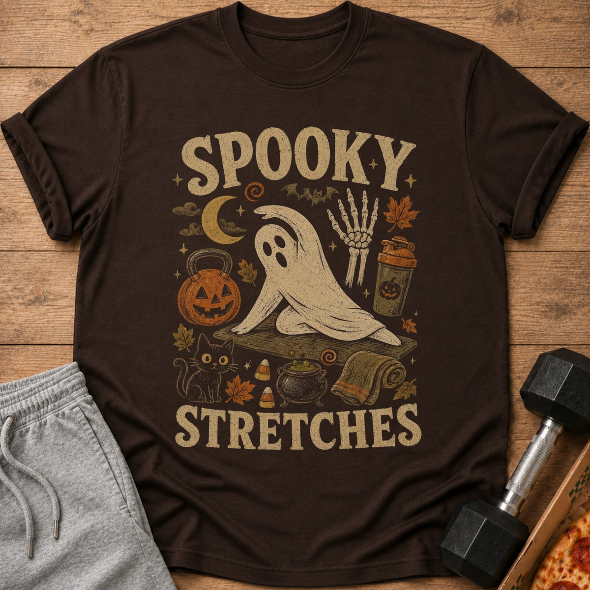 Brown t-shirt with "Spooky Stretches" text and Halloween-themed yoga ghost illustration.