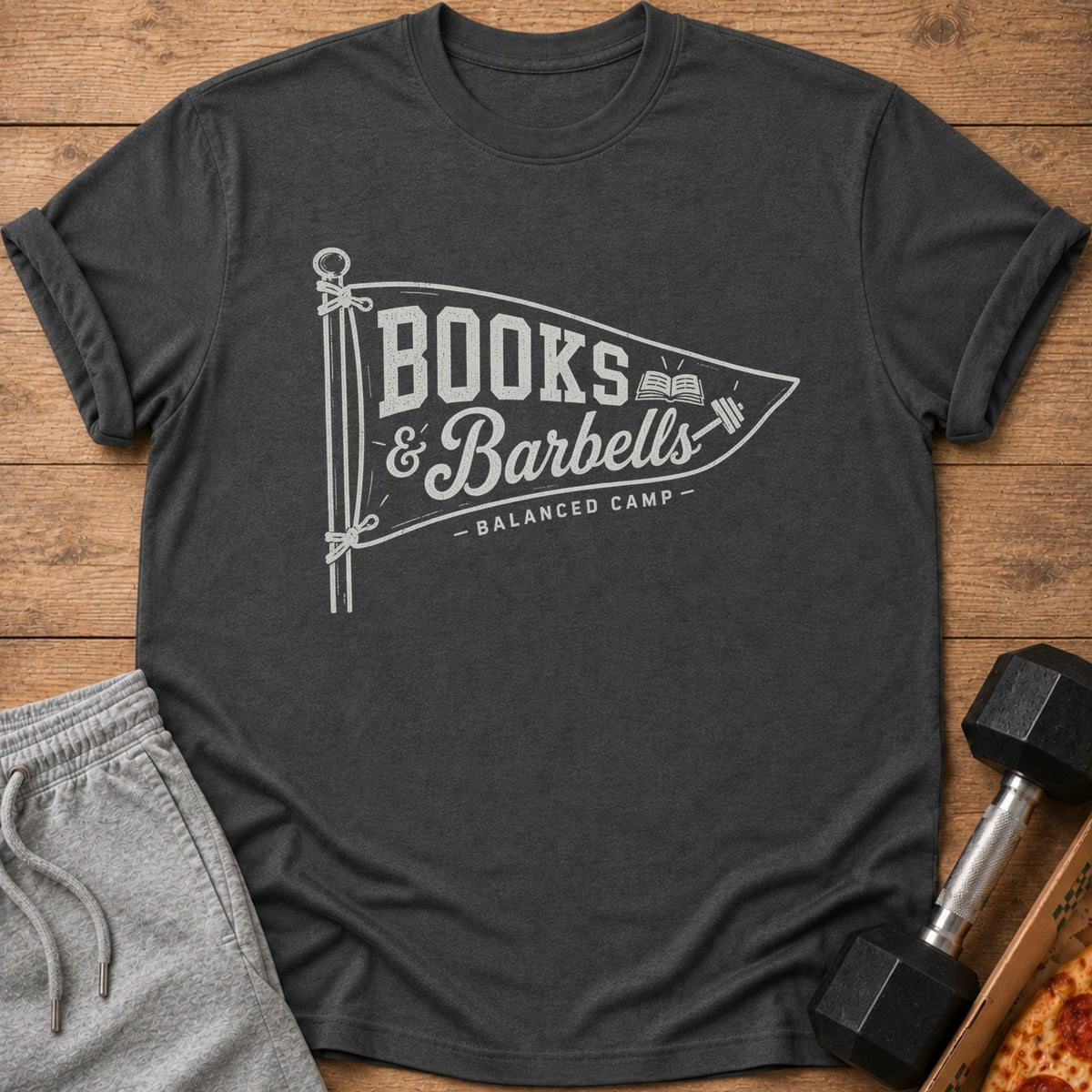 Dark grey t-shirt with "Books & Barbells - Balanced Camp" text in a pennant design.