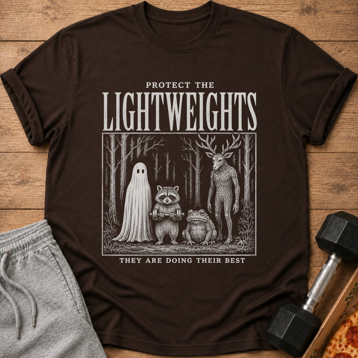 Brown t-shirt with "Protect the Lightweights" and forest creatures design.