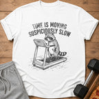 T-shirt with raccoon on treadmill saying "Time is moving suspiciously slow".