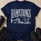 Navy t-shirt with white text "HAMSTRINGS" and a pig struggling on a bar.