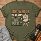 T-shirt with coffee cup character holding dumbbell and text "I showed up, that was the hard part".