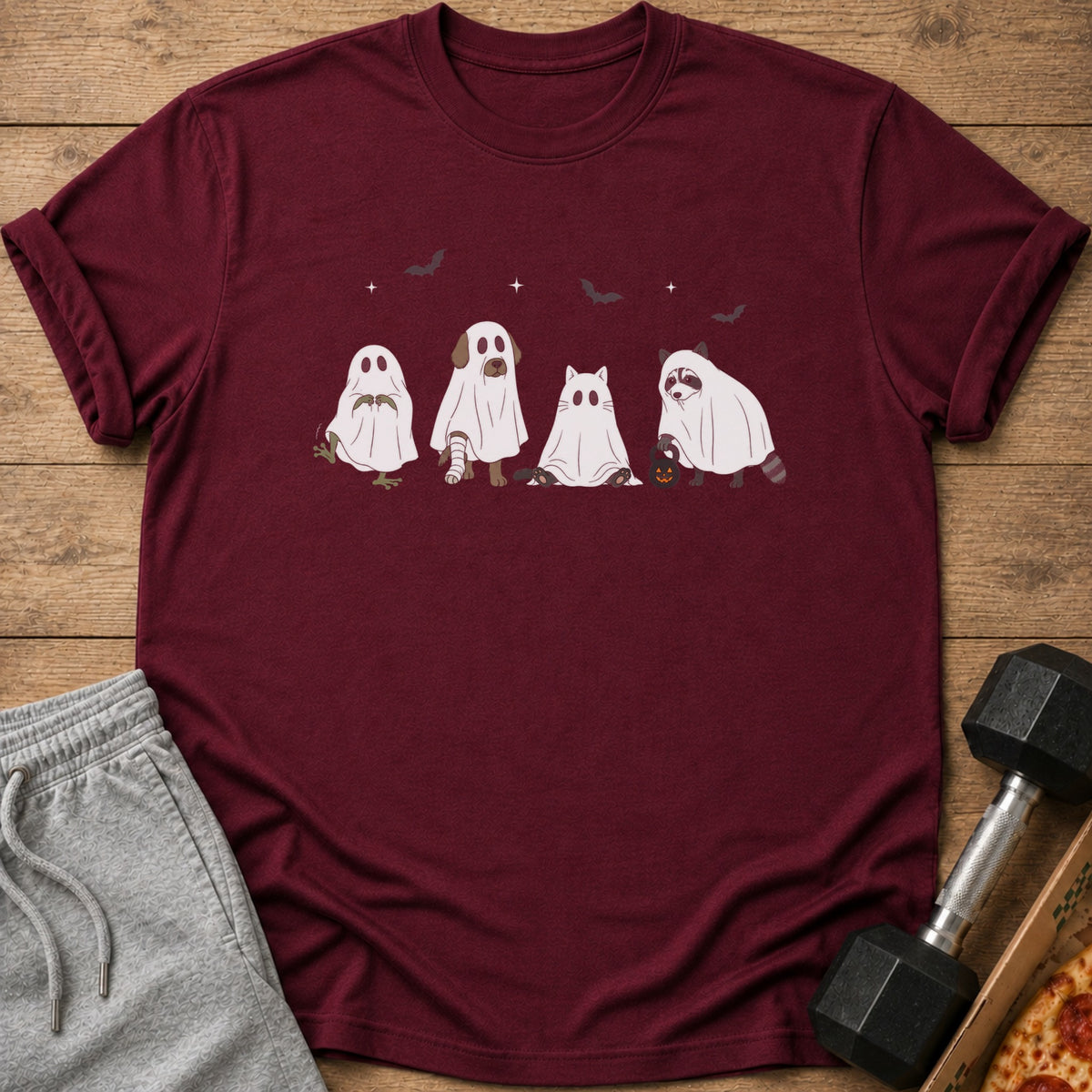 Maroon t-shirt with a graphic of four animals dressed as ghosts and bats.