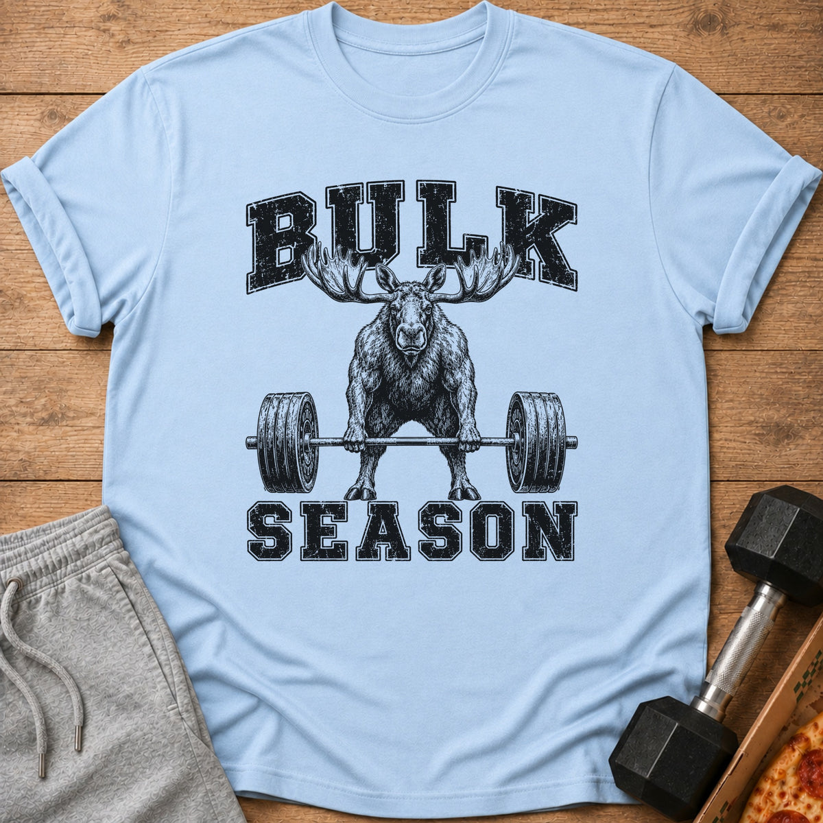 Light blue t-shirt with a distressed graphic of a moose lifting a barbell, reading "BULK SEASON".