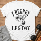 White t-shirt with black distressed text and a flamingo holding a kettlebell.