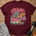 Maroon t-shirt with "Float Now Lift Later" text and a flamingo on a float.