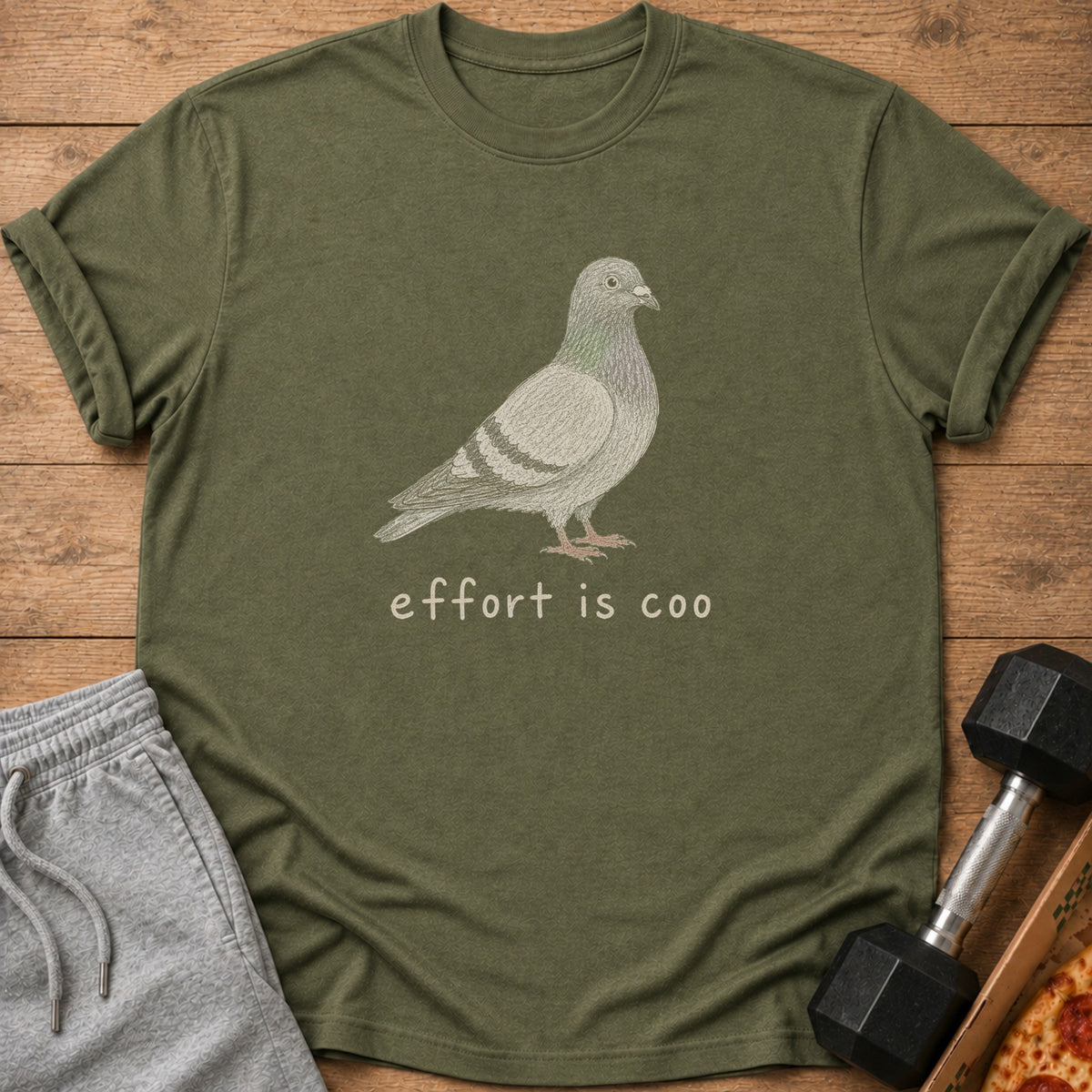 Green t-shirt with a pigeon graphic and text "effort is coo".
