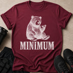Burgundy t-shirt with a distressed graphic of a tired bear lifting a dumbbell.