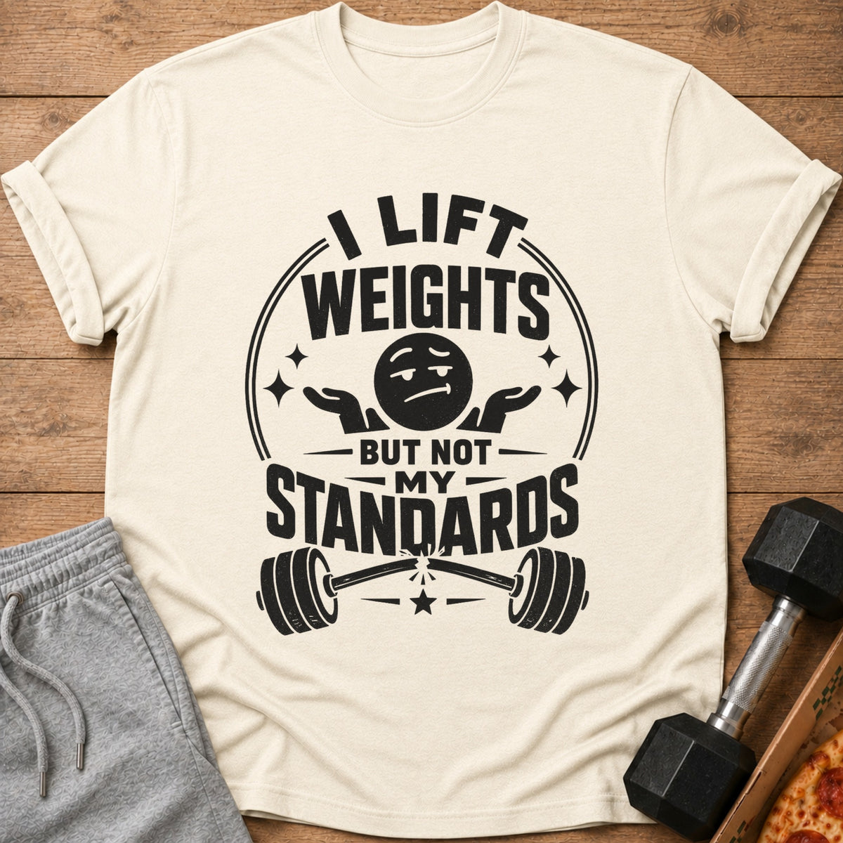 Cream t-shirt with "I lift weights but not my standards" graphic and broken barbell.