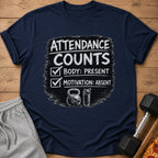 Navy t-shirt with "Attendance Counts: Body Present, Motivation Absent" text and gym icons.
