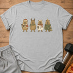 Gray t-shirt with four capybaras in festive Christmas outfits.