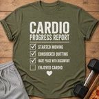 Green t-shirt with "Cardio Progress Report" checklist and a small heart.