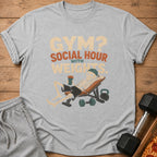 Grey t-shirt with graphic "Gym? Social Hour with Weights" and skeleton lifting weights.
