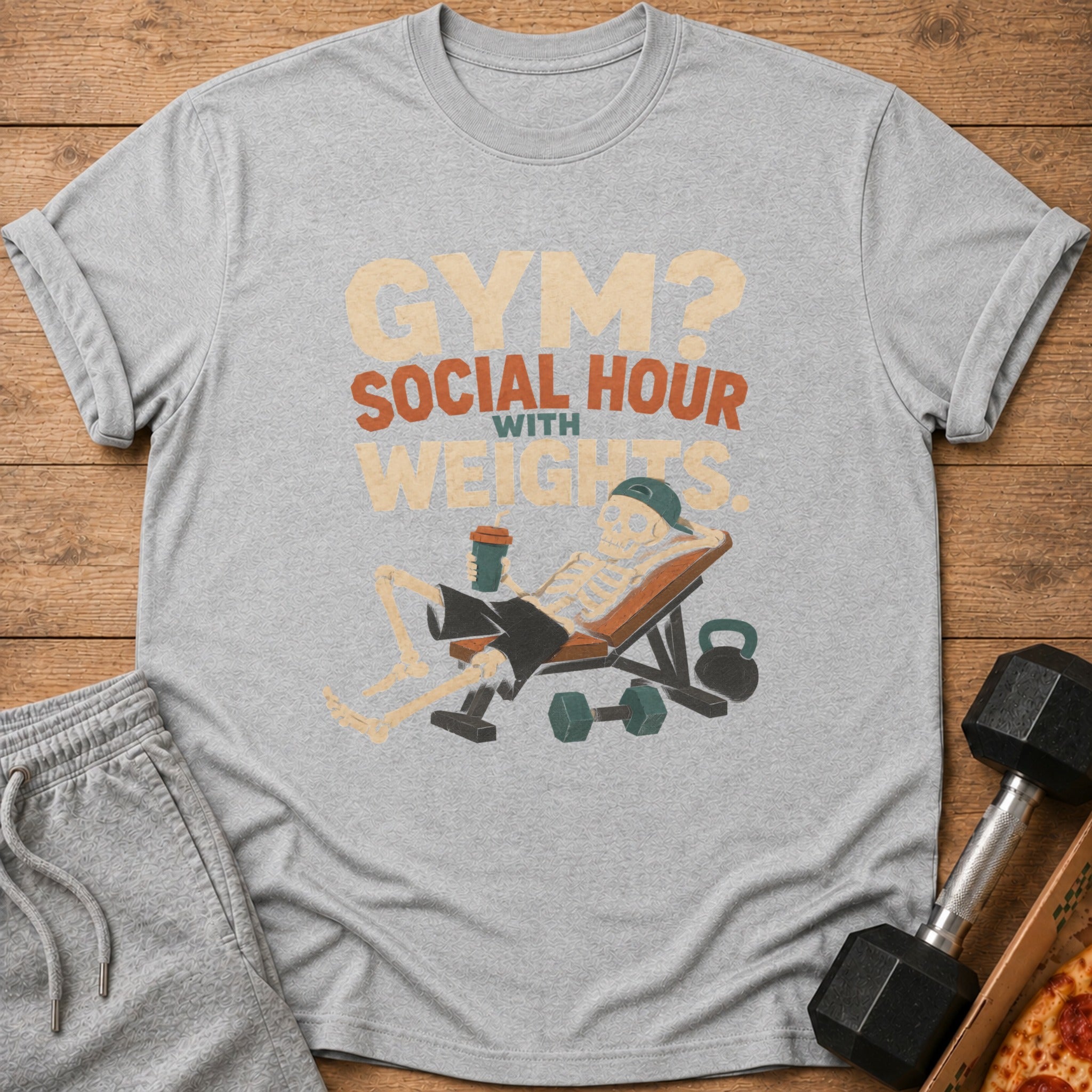 Grey t-shirt with graphic "Gym? Social Hour with Weights" and skeleton lifting weights.