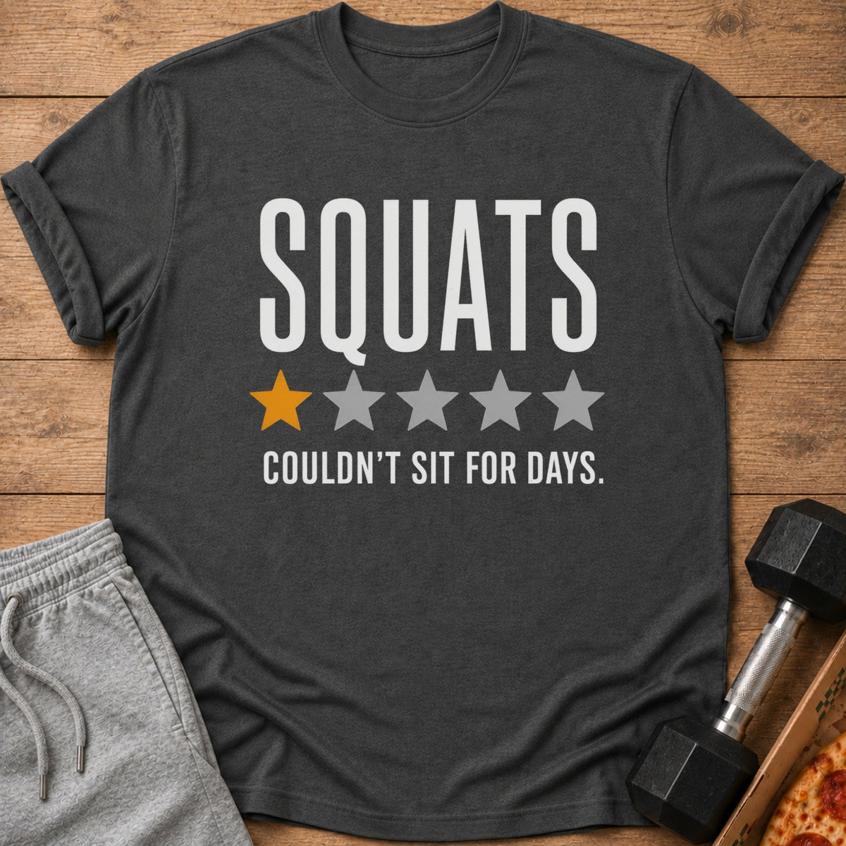 Dark t-shirt with "SQUATS" and one orange star, rest gray stars, and "COULDN'T SIT FOR DAYS."