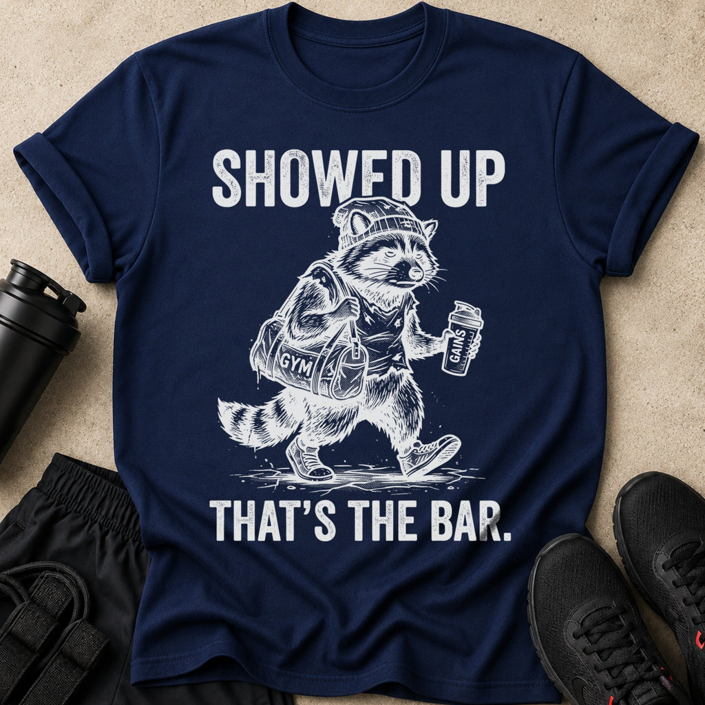 Navy t-shirt with raccoon in gym clothes: "Showed Up. That's the bar."