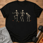 Black t-shirt with three dancing skeletons and falling leaves graphic.