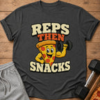 T-shirt graphic with text "REPS THEN SNACKS" featuring a cartoon pizza lifting a dumbbell.