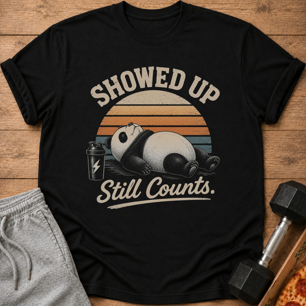 Black t-shirt with a panda and text "Showed Up Still Counts."