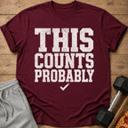 Maroon t-shirt with white distressed text "THIS COUNTS PROBABLY" and a checkmark.