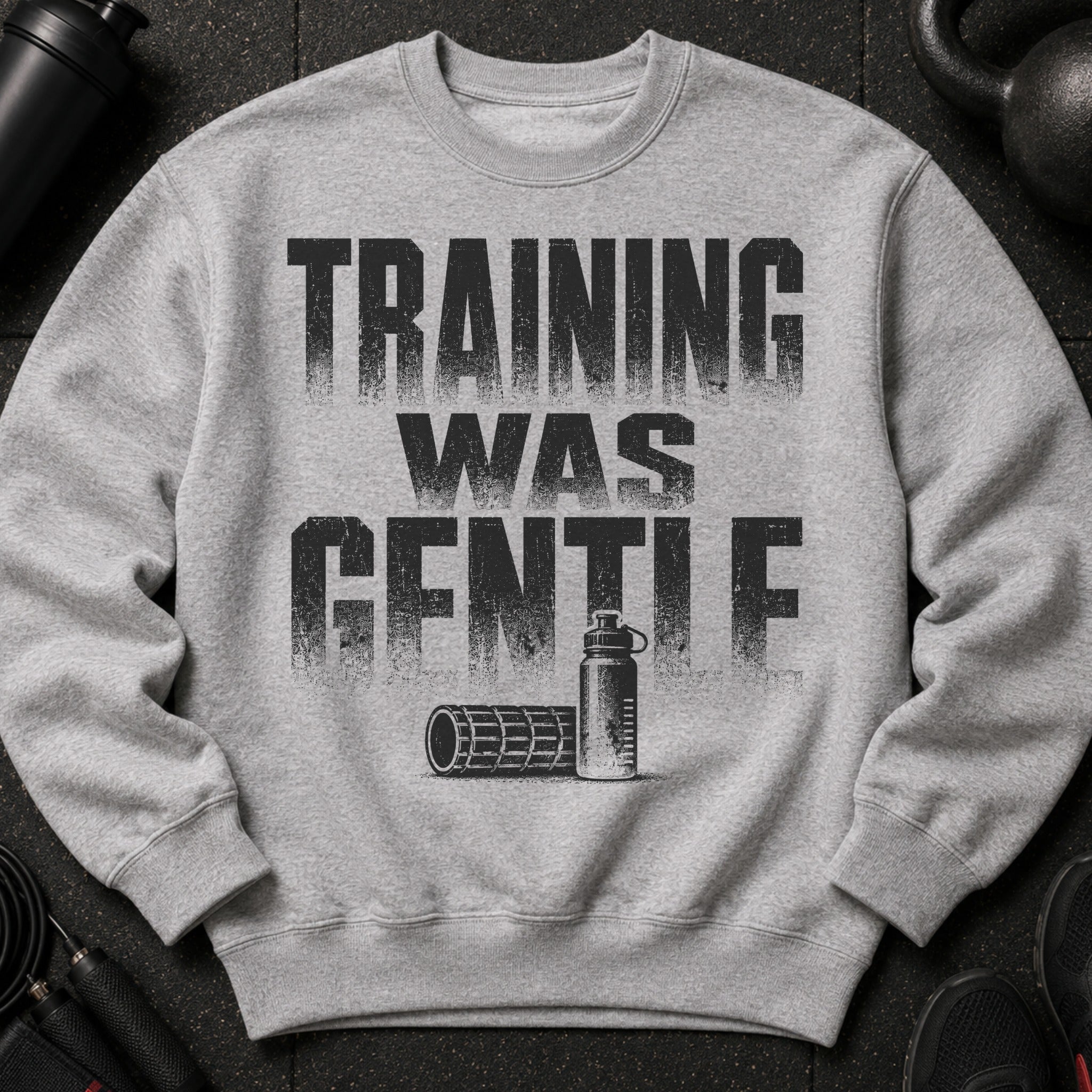 Gray sweatshirt with "TRAINING WAS GENTLE" text and gym accessories.