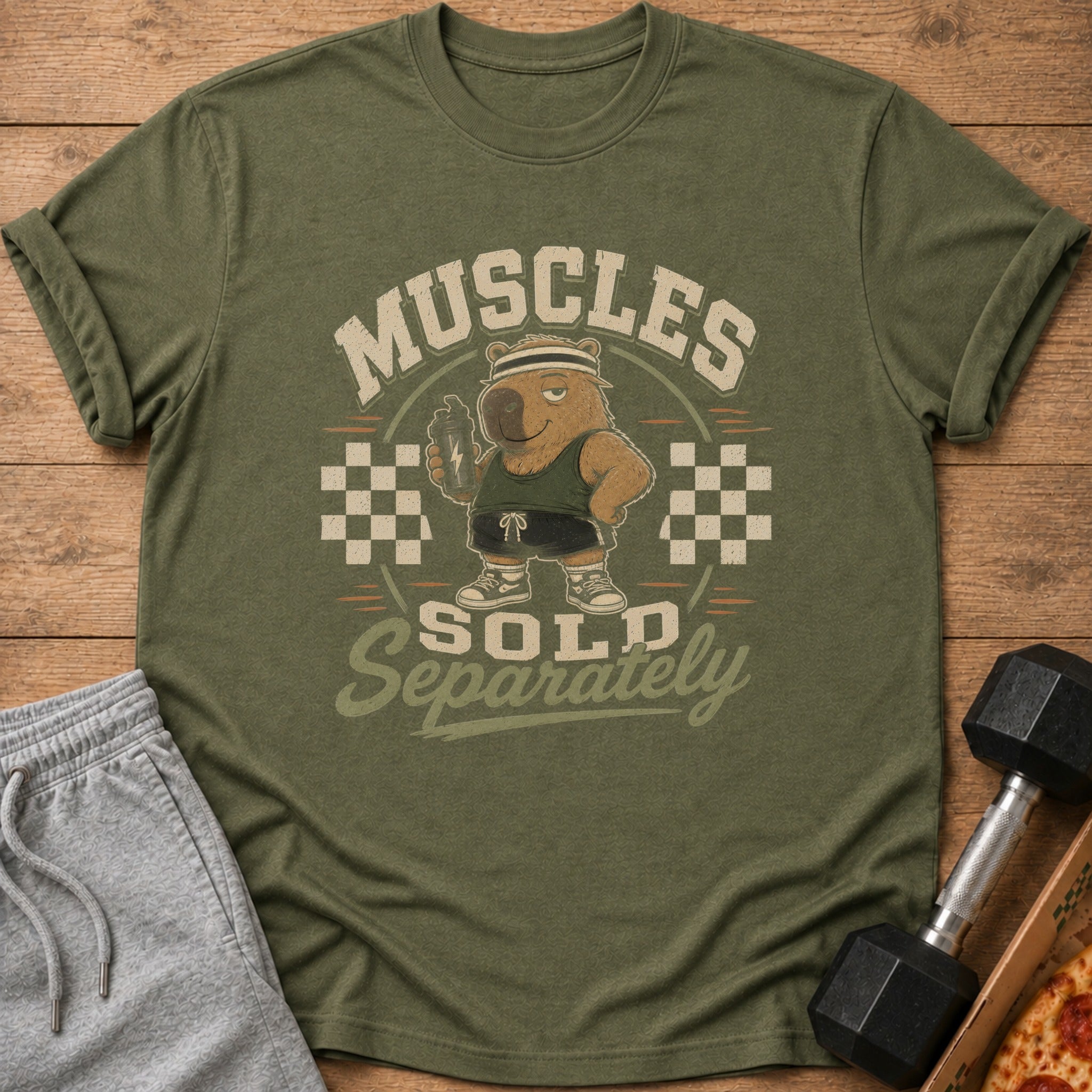Olive green t-shirt with cartoon bear, "MUSCLES SOLD SEPARATELY" text.