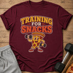 Maroon t-shirt with "TRAINING FOR SNACKS" text and cartoon pizza lifting weights.