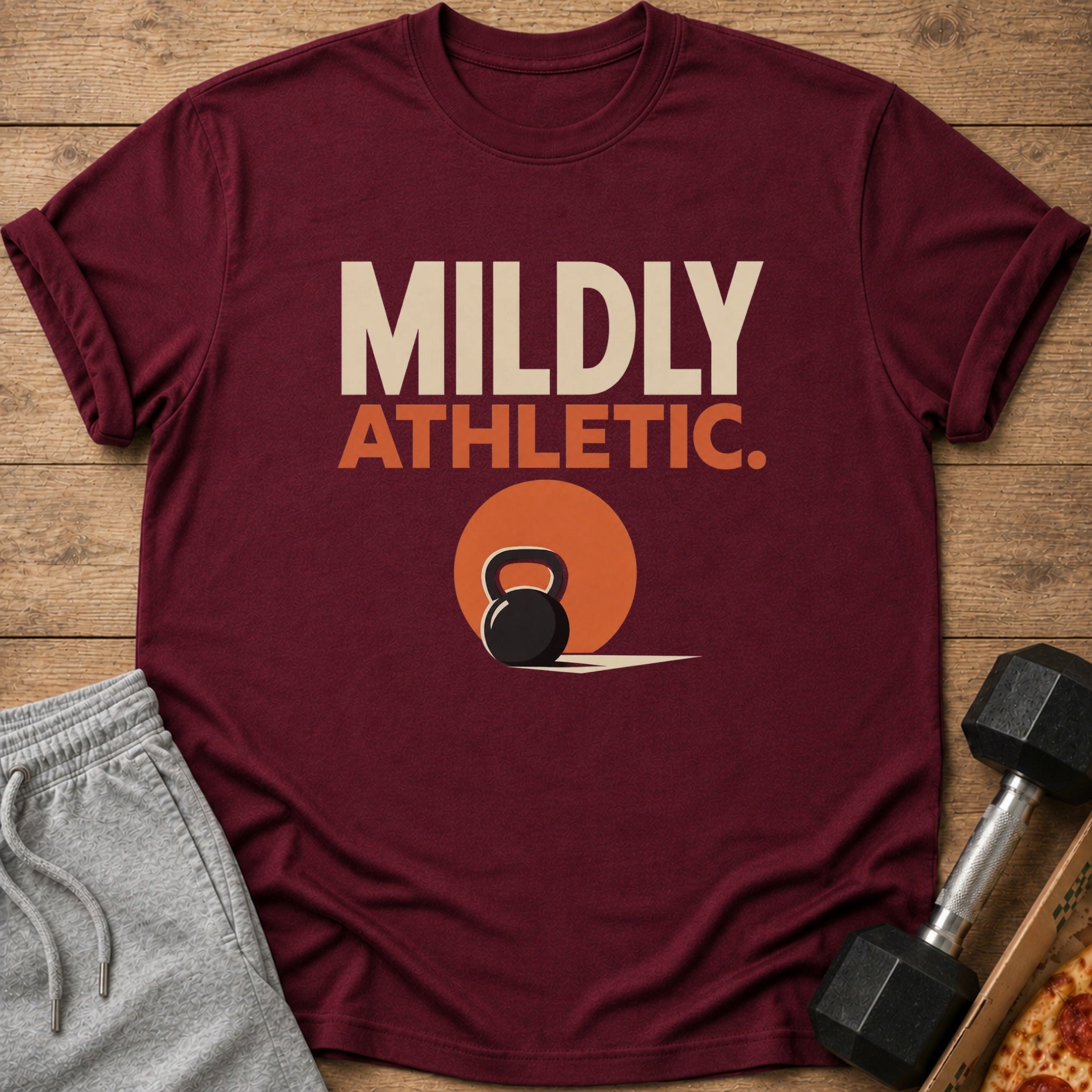 Maroon t-shirt with text "MILDLY ATHLETIC." and a kettlebell graphic.
