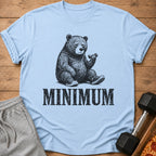 Light blue t-shirt with a black graphic of a tired bear lifting a dumbbell and the word "MINIMUM".