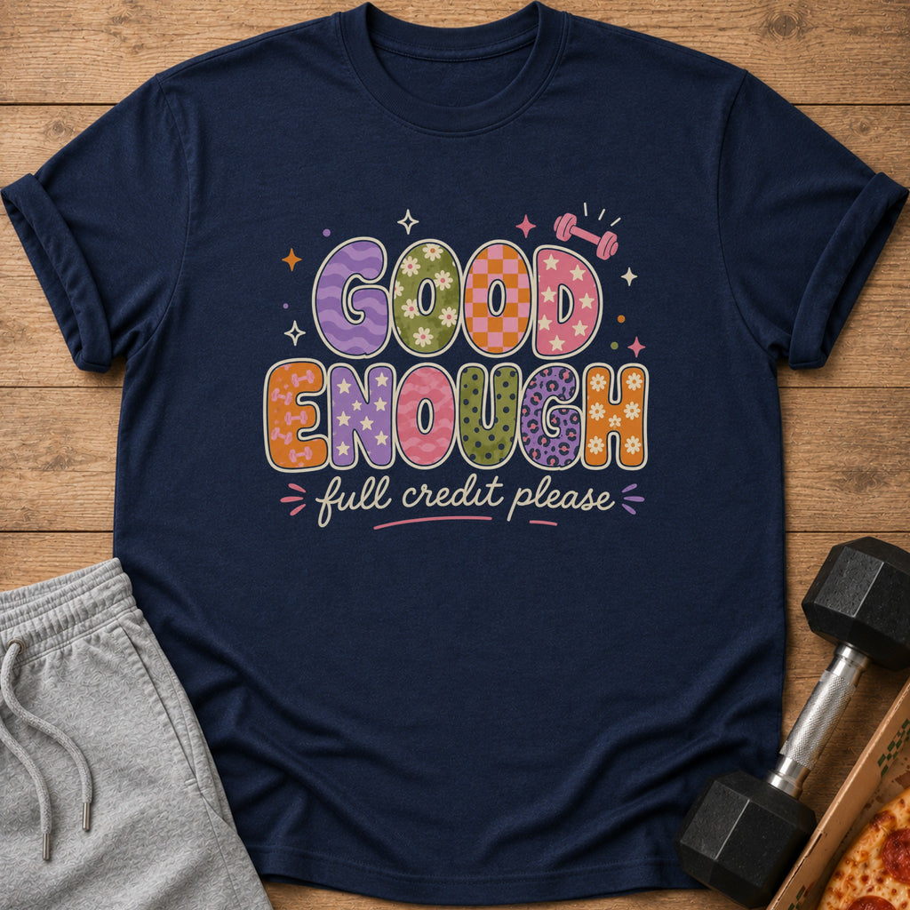 Navy t-shirt with "Good Enough" and "full credit please" in colorful retro lettering.