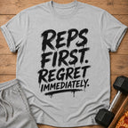 Grey t-shirt with black text "REPS FIRST. REGRET IMMEDIATELY."