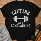 Black t-shirt with white text "Lifting and Complaining" and dumbbell graphic.