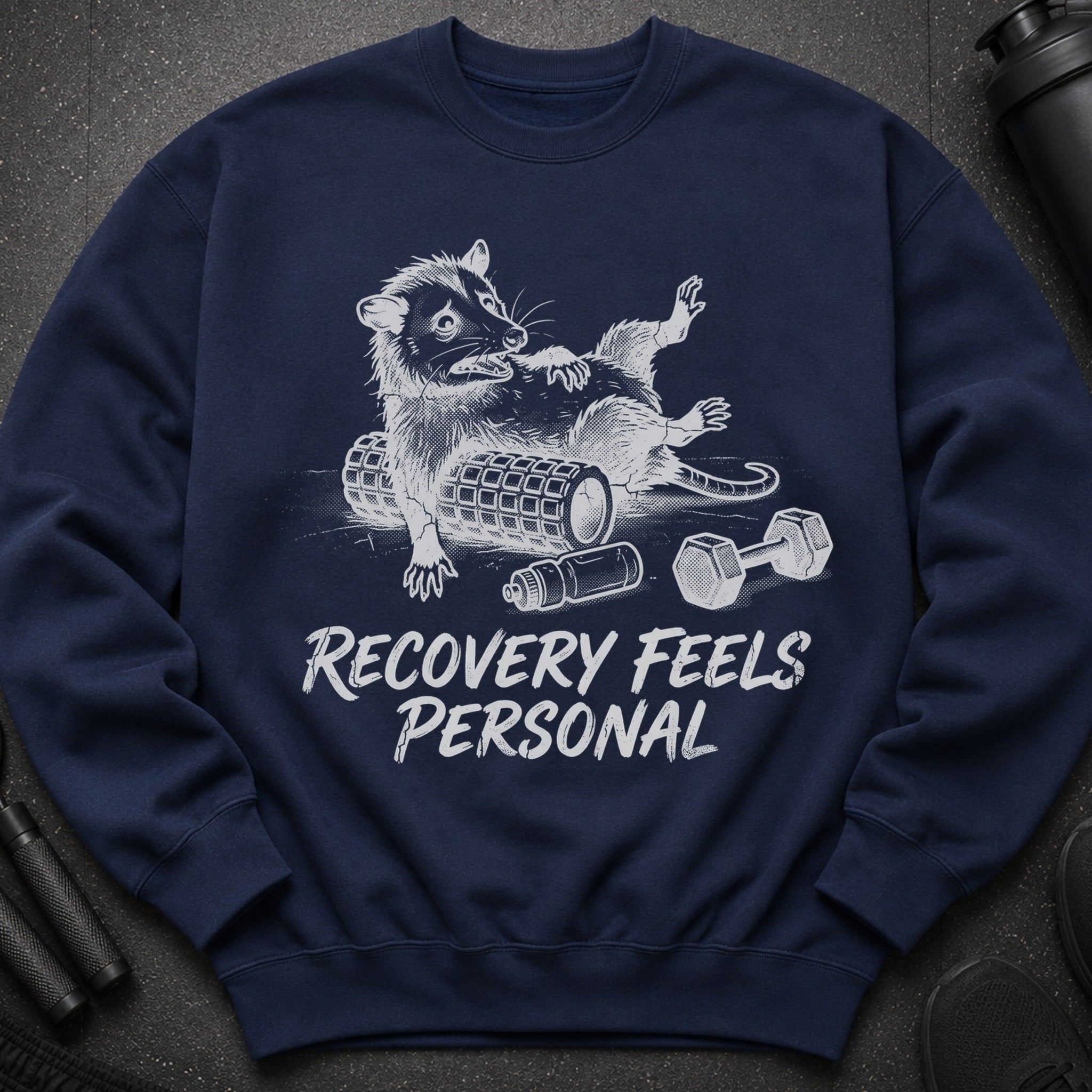 Navy sweatshirt with a raccoon exercising and text "Recovery Feels Personal".