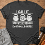 T-shirt with cartoon kettlebells and text: "I call it strength training but mostly it's emotional damage."