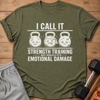Olive green t-shirt with text "I CALL IT STRENGTH TRAINING BUT MOSTLY IT'S EMOTIONAL DAMAGE".