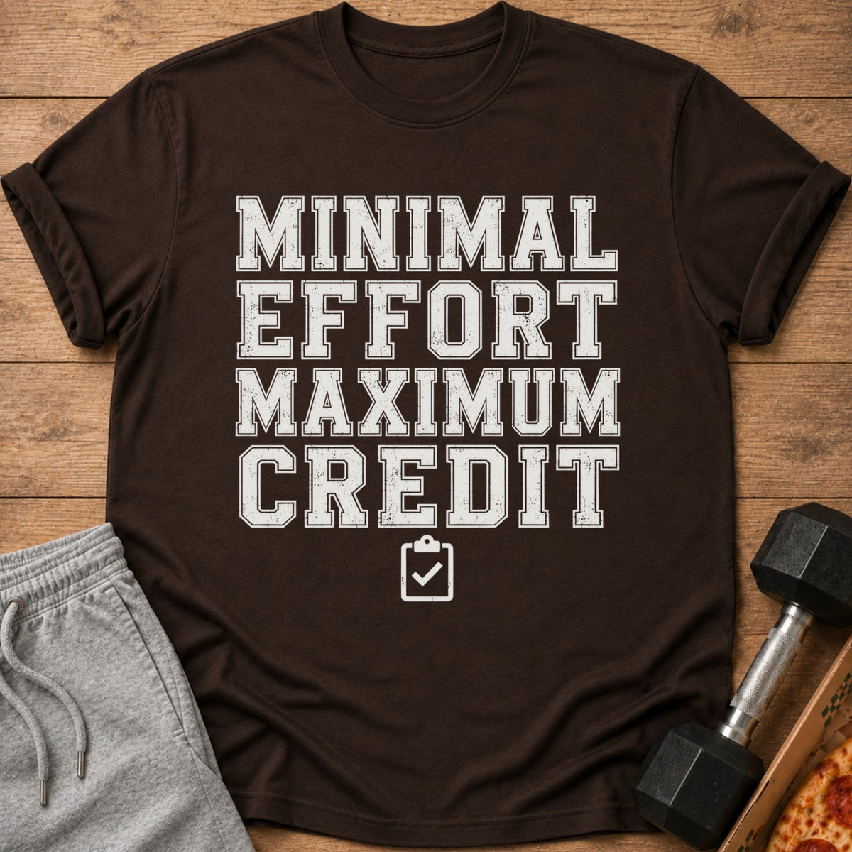 Brown t-shirt with text "Minimal Effort Maximum Credit" and a checklist icon.
