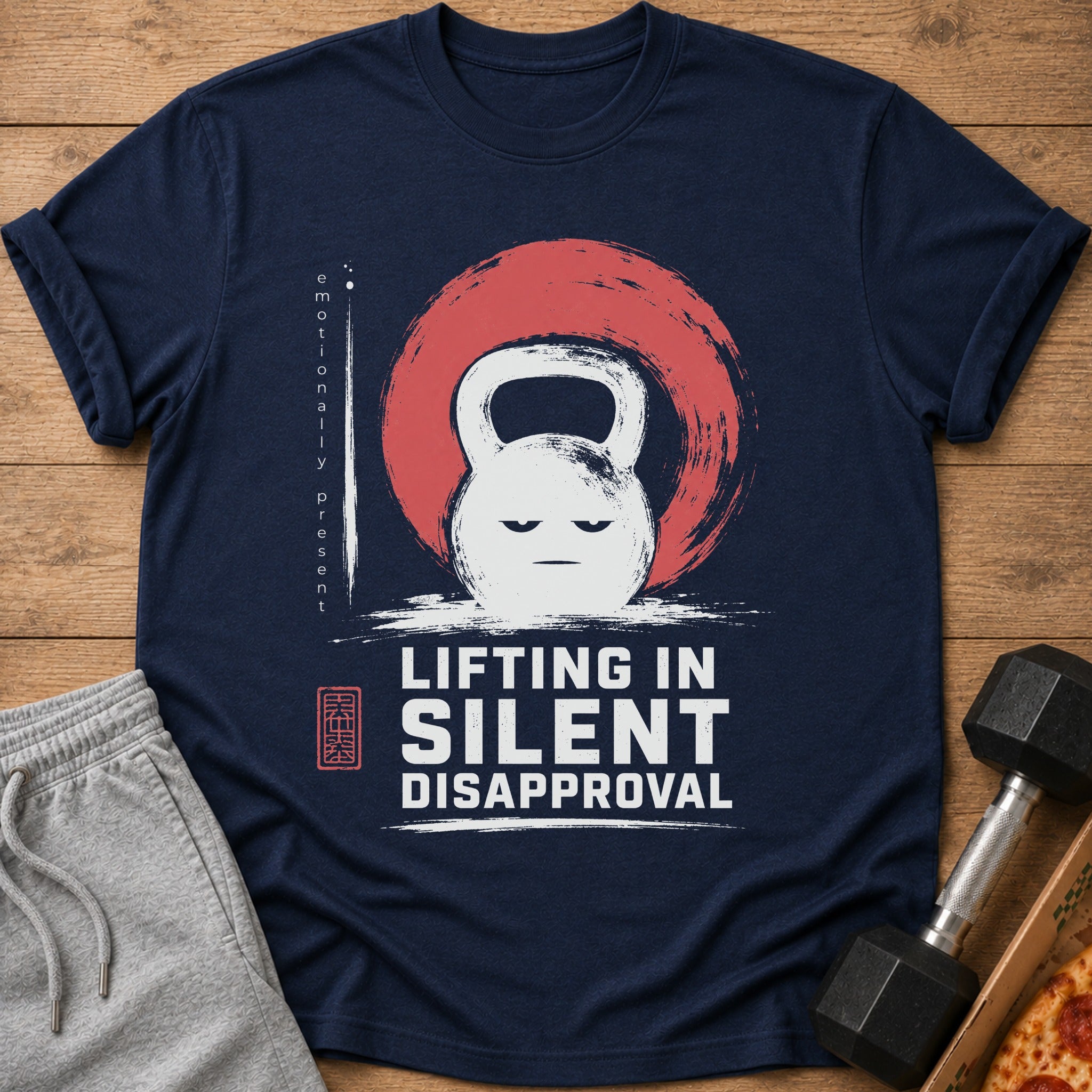 Navy t-shirt with a distressed kettlebell design and the text "LIFTING IN SILENT DISAPPROVAL".