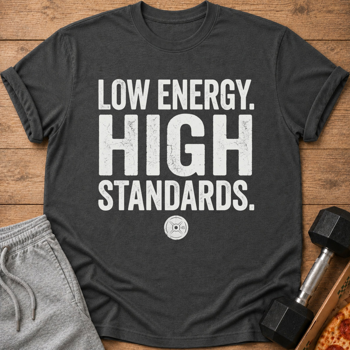 Dark grey t-shirt with "LOW ENERGY. HIGH STANDARDS." text and a weight plate graphic.