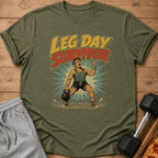 Green t-shirt with "LEG DAY SURVIVOR" text and a cartoon weightlifter.