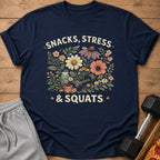 Navy t-shirt with floral design and text "SNACKS, STRESS & SQUATS".