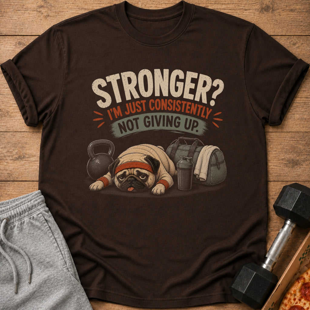 Brown t-shirt with a pug at the gym, reading "Stronger? I'm just consistently not giving up."