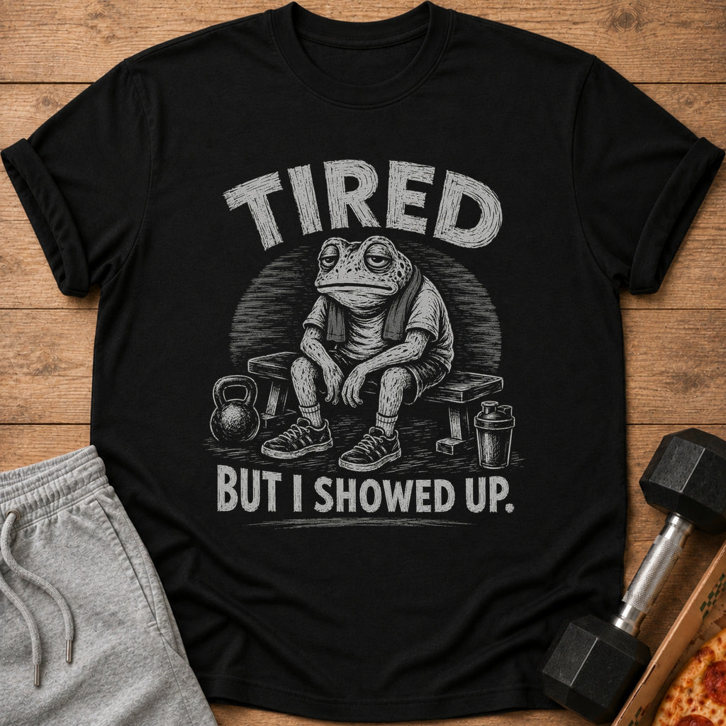Black t-shirt with tired frog graphic, text "TIRED BUT I SHOWED UP."
