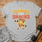 Gray t-shirt with cartoon pizza lifting dumbbells and text "Training for Snacks".