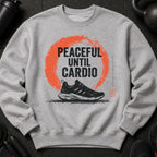 Grey sweatshirt with text "Peaceful Until Cardio" over a running shoe graphic.