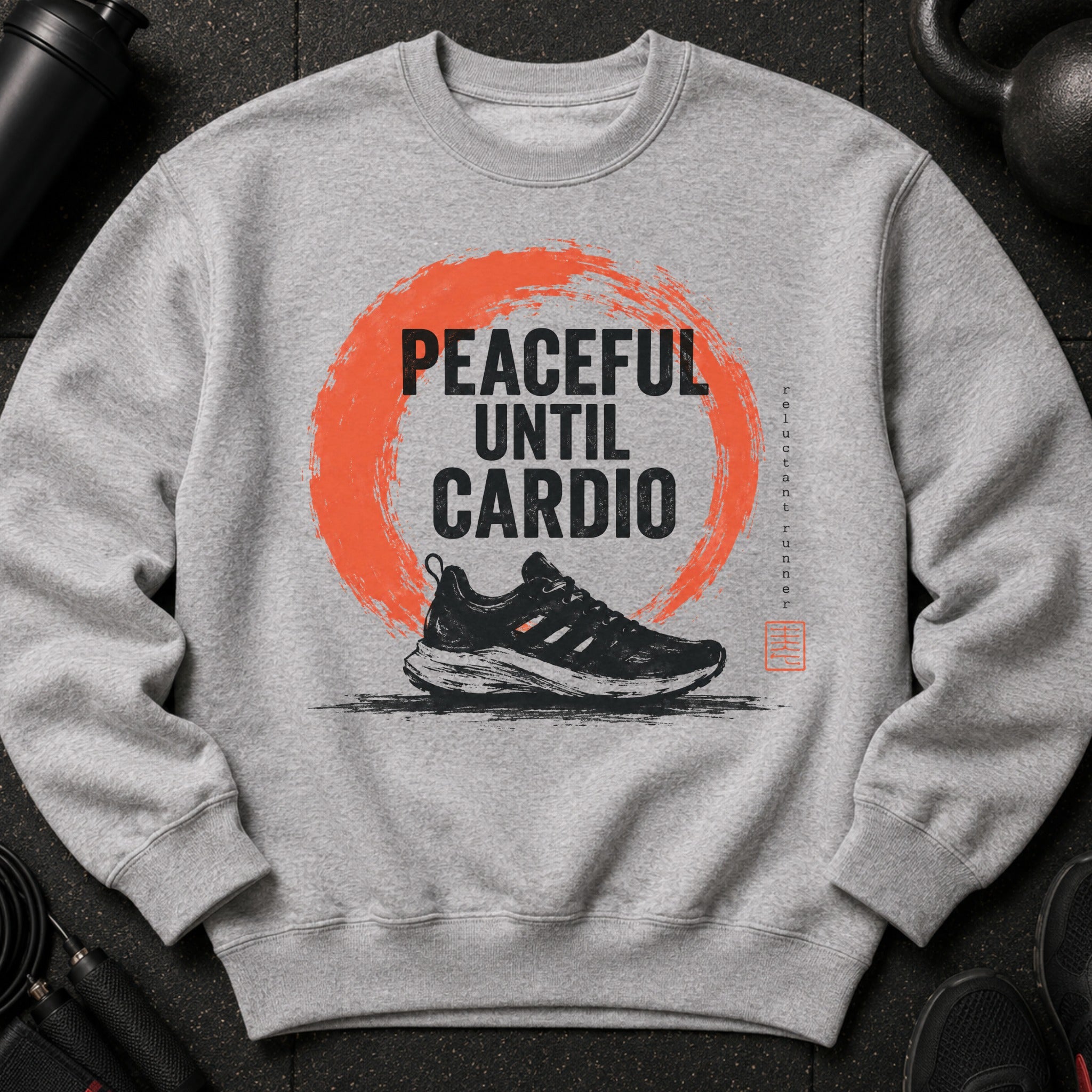 Grey sweatshirt with text "Peaceful Until Cardio" over a running shoe graphic.
