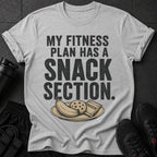 Grey t-shirt with "MY FITNESS PLAN HAS A SNACK SECTION" and a plate of snacks.