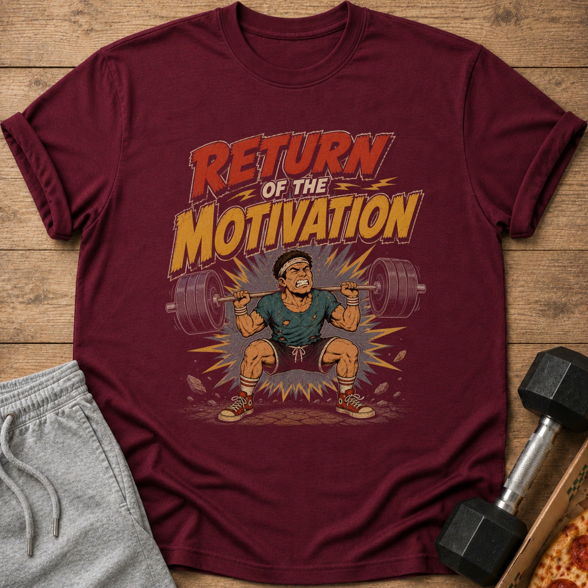 Maroon t-shirt with "Return of the Motivation" text and cartoon weightlifter.