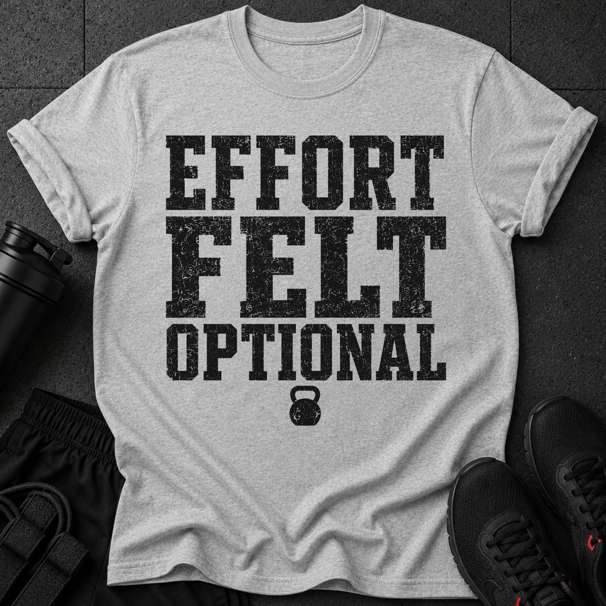 Grey t-shirt with black distressed text "EFFORT FELT OPTIONAL" and a kettlebell.
